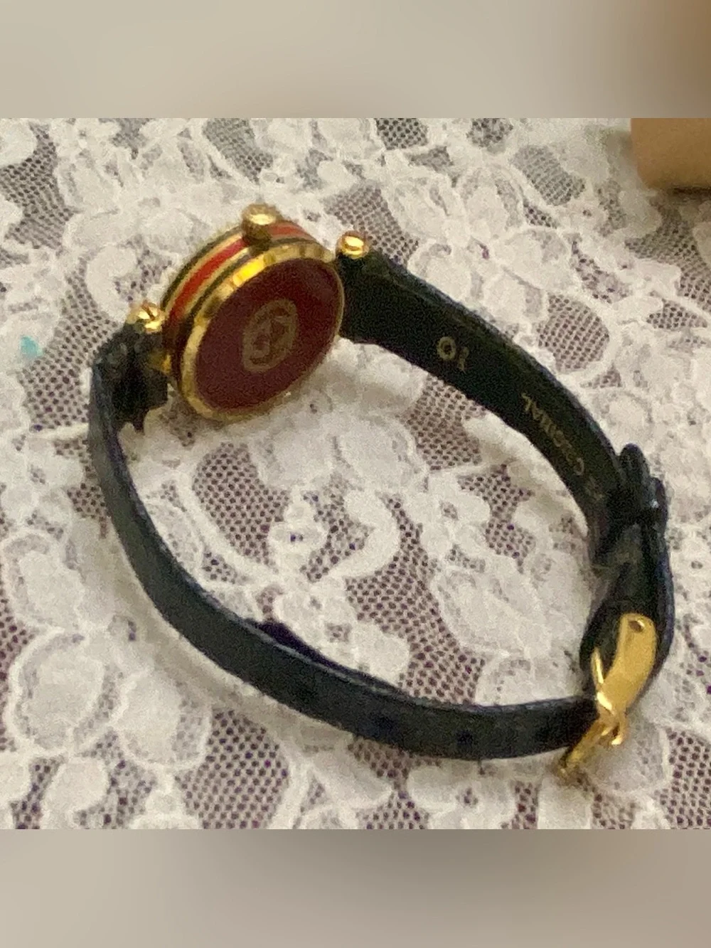 Gucci, Swiss Made, Quartz Gold Tone Ladies Watch with Burgundy Glass Backing